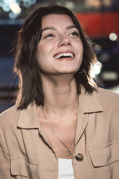 Closeup portrait of a woman with hair blowing in the wind