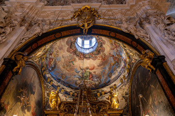Baroque baldachin with black marble solomonic columns inside the Chapel of San Pedro Arbues at the Cathedral of La Seo, ornate interior architecture in Zaragoza. © javier