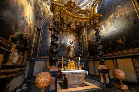 Baroque baldachin with black marble solomonic columns inside the Chapel of San Pedro Arbues at the Cathedral of La Seo, ornate interior architecture in Zaragoza.