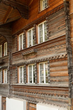 Guttannen, Switzerland. Traditional carved wooden chalet facade with historic alpine craftsmanship