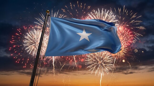 National flag of Somalia waving on pole with colorful fireworks display in dark night sky background