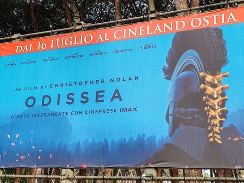 Ostia, Rome, Italy - July 21, 2026, advertising panel for director Christopher Nolan's film Odyssey, shot with an IMAX camera, in the pine forest of the Cineland Multiplex.