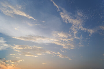 Fototapeta premium Dramatic Sunset Sky with Glowing Clouds and Golden Sunlight over a Peaceful Summer Landscape Cloudscape