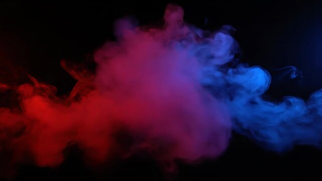 Red and blue ink clouds swirling in water against a black background