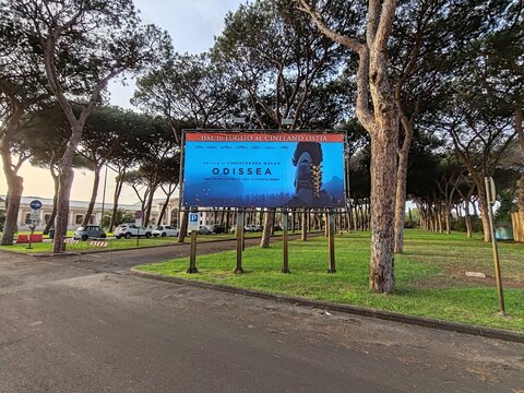 Ostia, Rome, Italy - July 21, 2026, advertising panel for director Christopher Nolan's film Odyssey, shot with an IMAX camera, in the pine forest of the Cineland Multiplex.