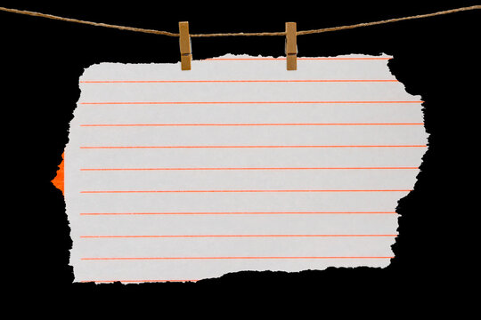 Blank sheet of paper hanging on a clothesline, attached with a wooden clothespin. Isolated black JPEG.