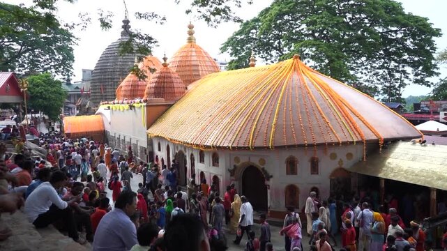 GUWAHATI, ASSAM, INDIA - JULY 10, 2019: View of Kamakhya Temple situated on Nilachal Hill with a huge crowd of devotees gathered outside during Ambubachi Mela in Guwahati, Assam, India. 