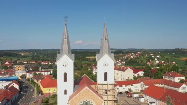 Aerial view of tower bells and church of St. Mary Magdalene in town of Cazma, Moslavina, Croatia