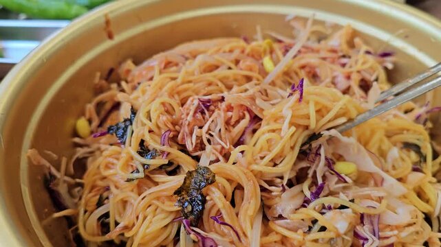 A video showing noodles, a representative commoner&rsquo;s food in Korea, served in a bowl
