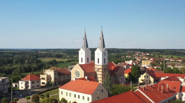Aerial view of tower bells and church of St. Mary Magdalene in town of Cazma, Moslavina, Croatia
