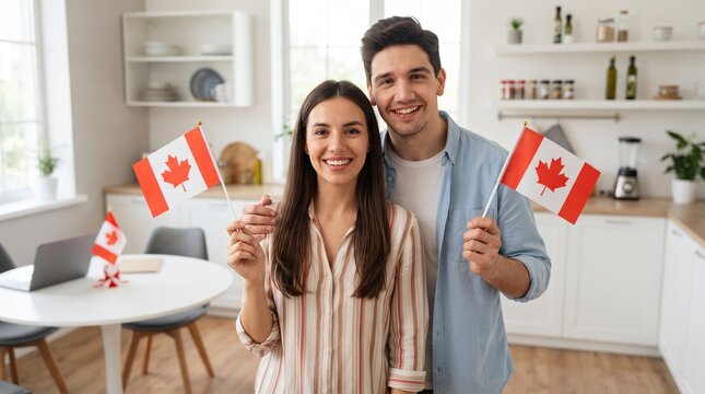 Young couple with flags of Canada in kitchen
