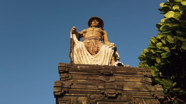 Low Angle of Balinese Fisherman Statue Landmark at Kedungu Beach Bali