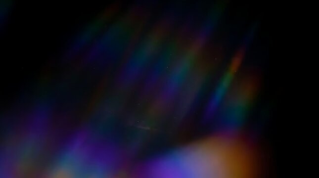 Abstract rainbow light prism spectrum streaks on dark background with soft flowing colorful gradients.