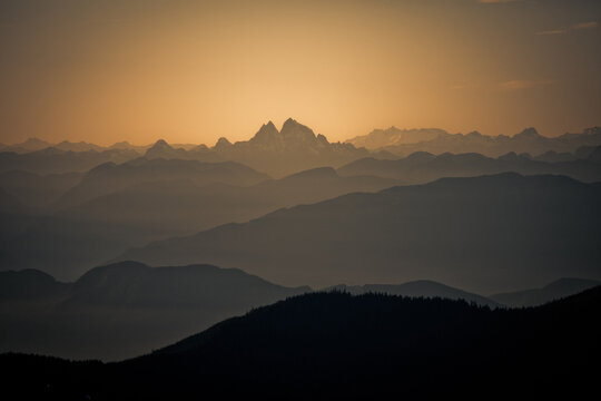 Hazy mountain layers during a golden hour sunset