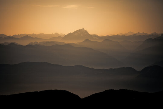Layers of hazy mountains at golden hour