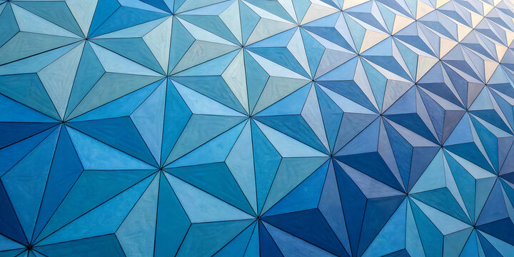 Abstract geometric pattern of blue triangular building panels