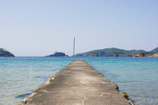 Concrete Pier on Crystal Clear Sea near a Fishing Harbor in Shimane Japan