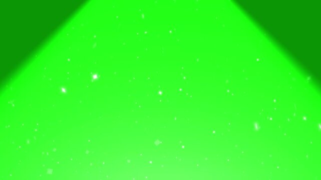 Spotlight effect casts a bright glow across a green backdrop with sparkling dust motes drifting in the air.