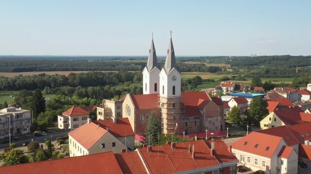 Aerial view of tower bells and church of St. Mary Magdalene in town of Cazma, Moslavina, Croatia