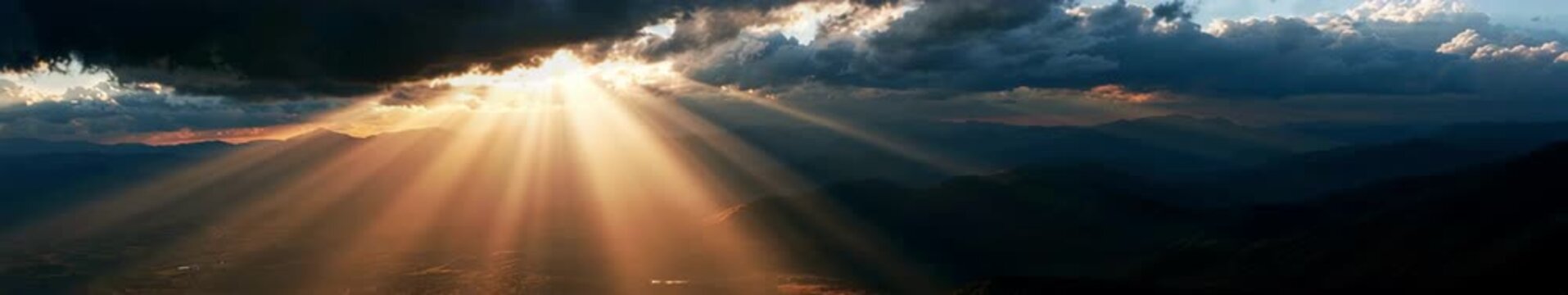 Golden Sun Rays Breaking Through Dramatic Storm Clouds Over Mountain Valley, Seamless Loop Animation, Wide Format