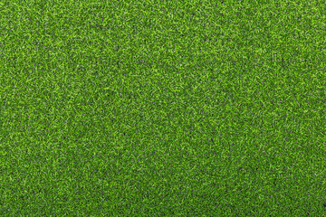 Artificial soccer turf texture with dense green synthetic grass blades in close up view. Sports background for soccer field, training ground, playground, and outdoor design. © natrot