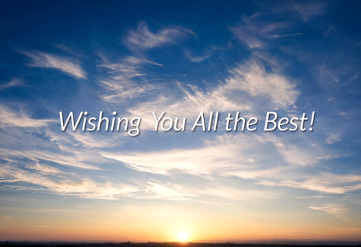 Beautiful sunset sky with soft clouds and warm colors wishing good luck and success ahead