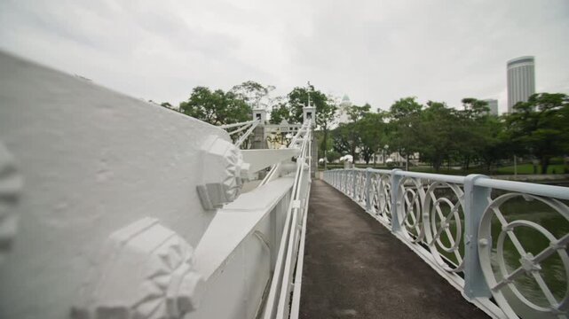 Elegant Cavenagh Bridge architecture creating an iconic urban landmark in Singapore city with scenic river views and unforgettable tourism across Asia 