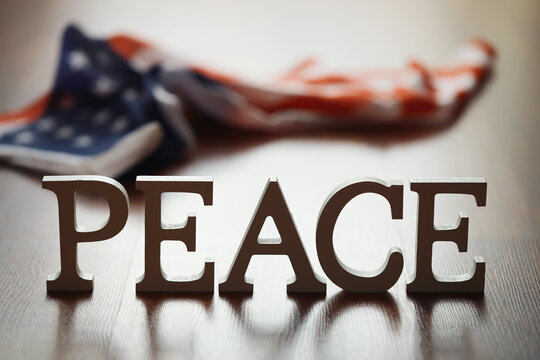 Peace Word Written In Wooden Letters. International conflict, American hegemony, War. Ukraine and Russia.