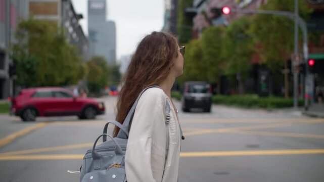 Female Caucasian traveler exploring downtown Singapore with modern skyscrapers urban architecture and vibrant city life in the heart of Asia