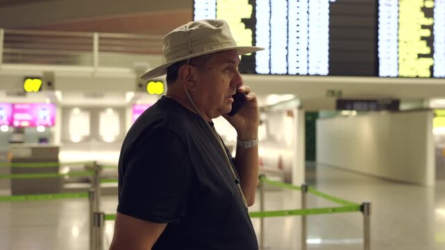 Tourist traveler talking on phone at airport terminal