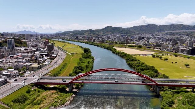 Fly slow towards Akio bridge over Ota river in Hiroshima