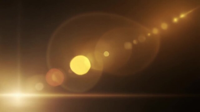 Warm golden light wash flows across deep black background, honey gold, amber, soft peach gradients creating cinematic light leak overlay for filmmaking, video editing, motion graphics, copy space.