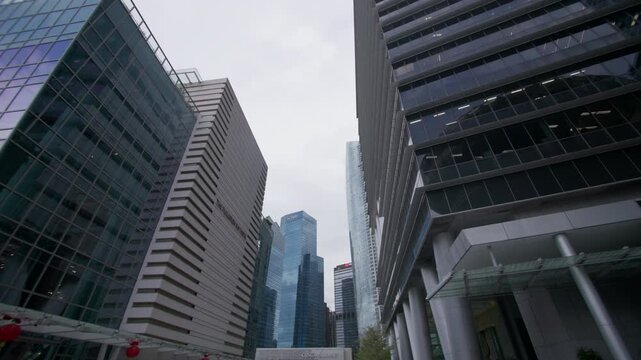 Elegant OUE Tower architecture surrounded by modern skyscrapers creating an iconic Singapore city skyline and vibrant urban landscape in Asia