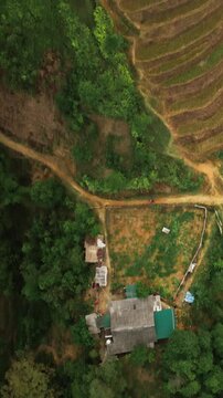 Aerial Vertical Top Down View of Rice Terraces and Rural Village in Sa Pa, Lao Cai, Vietnam