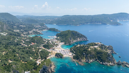 Obraz premium Palaiokastrites village and monastery overseeing Ionian Sea coastline, Corfu