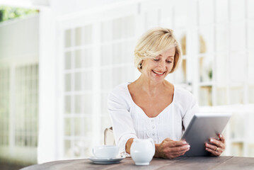 Fototapeta na wymiar Smile, coffee and tablet with old woman in home for retirement fund savings, pensioner asset and budget. Tax return, drink and loan approval with senior person in apartment for online finance