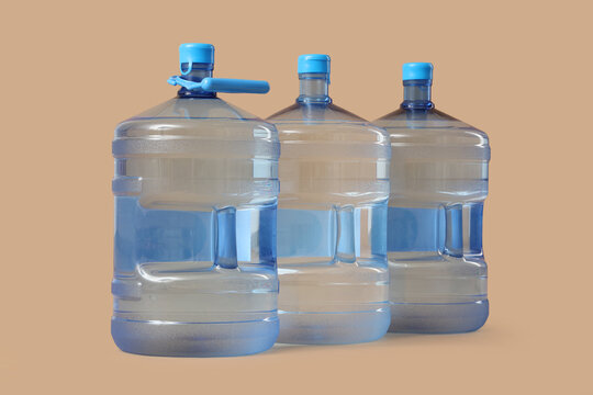 Bottles of clean water on beige background