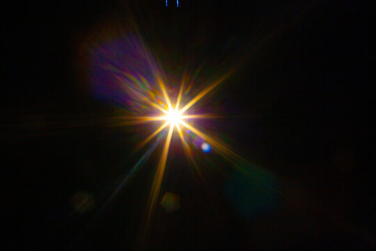 Sun flare on the black background