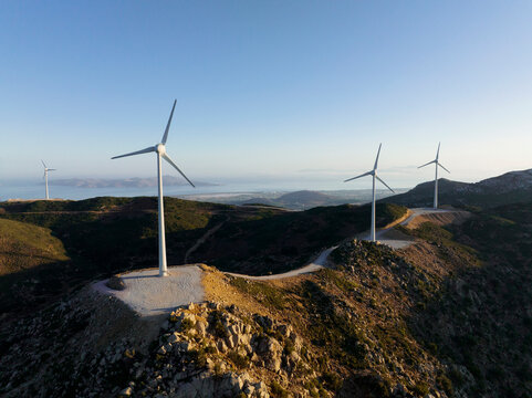 Greece, Aegean, Kos, Wind farm turbines at dawn