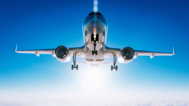 A commercial airplane approaches landing in a bright blue sky