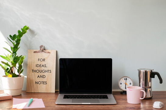 Desk with laptop at home office
