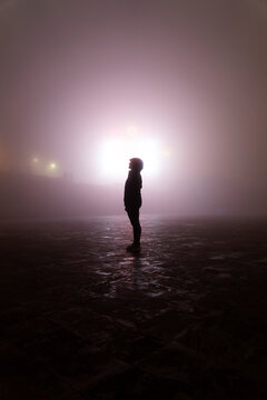 Silhouette standing in mysterious fog at night in Sapa Vietnam