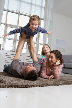 Playful family in living room