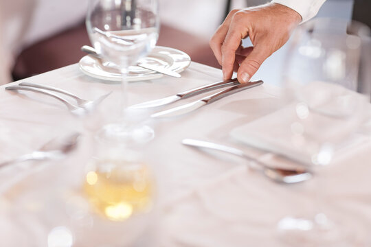 Restaurant staff setting tables