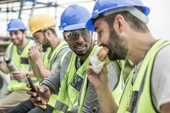 Construction workers having lunch break on construction site