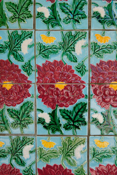 Floral ceramic tiles on walls of 'five foot' passage way along row of conserved pre-war terrace houses designed in Chinese Baroque style with neo-classical and Peranakan features