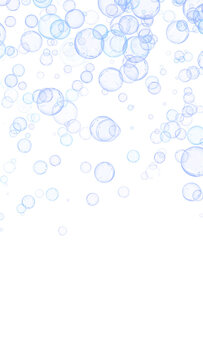 Abundant blue glossy soap bubbles vertical cascade isolated on transparent background. Vertical frame layout. Dynamic clear air droplets overlay