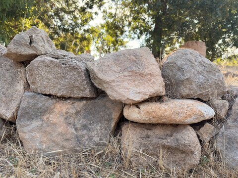 Dry stone boundary wall at the reconstructed prehistoric settlement of Lemba-Lakkoi, Paphos, Cyprus