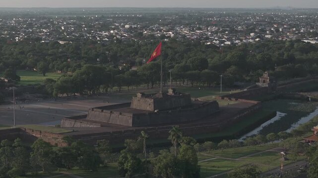 Aerial drone view of Hue Imperial Citadel featuring Ngo Mon Gate and Hue Flag Tower, showcasing Vietnam's UNESCO World Heritage site with majestic royal architecture and historic fortress.