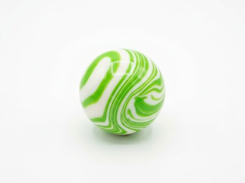 Green and white swirl glass marble isolated on white background